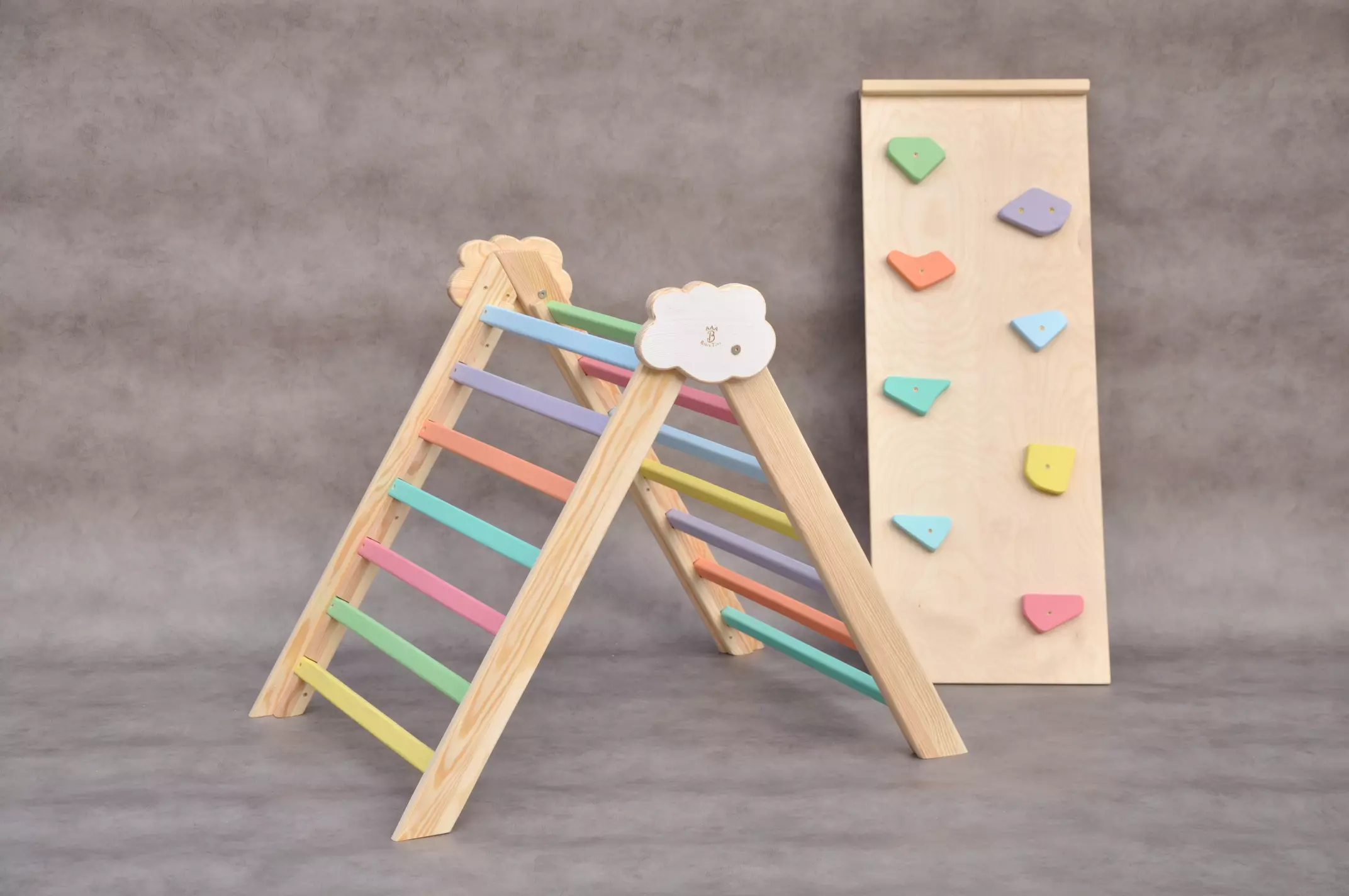 Rainbow wooden climbing frame indoor Cloud baby climber gym with rocks climbing slide and board available for sale at BarinToys online store.