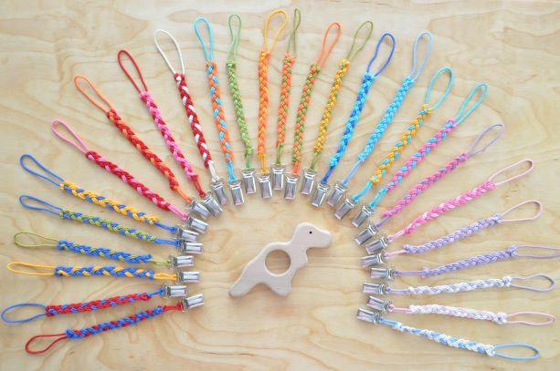 Select pacifier clip color for a baby T Rex dinosaur teether on BarinToys.com.